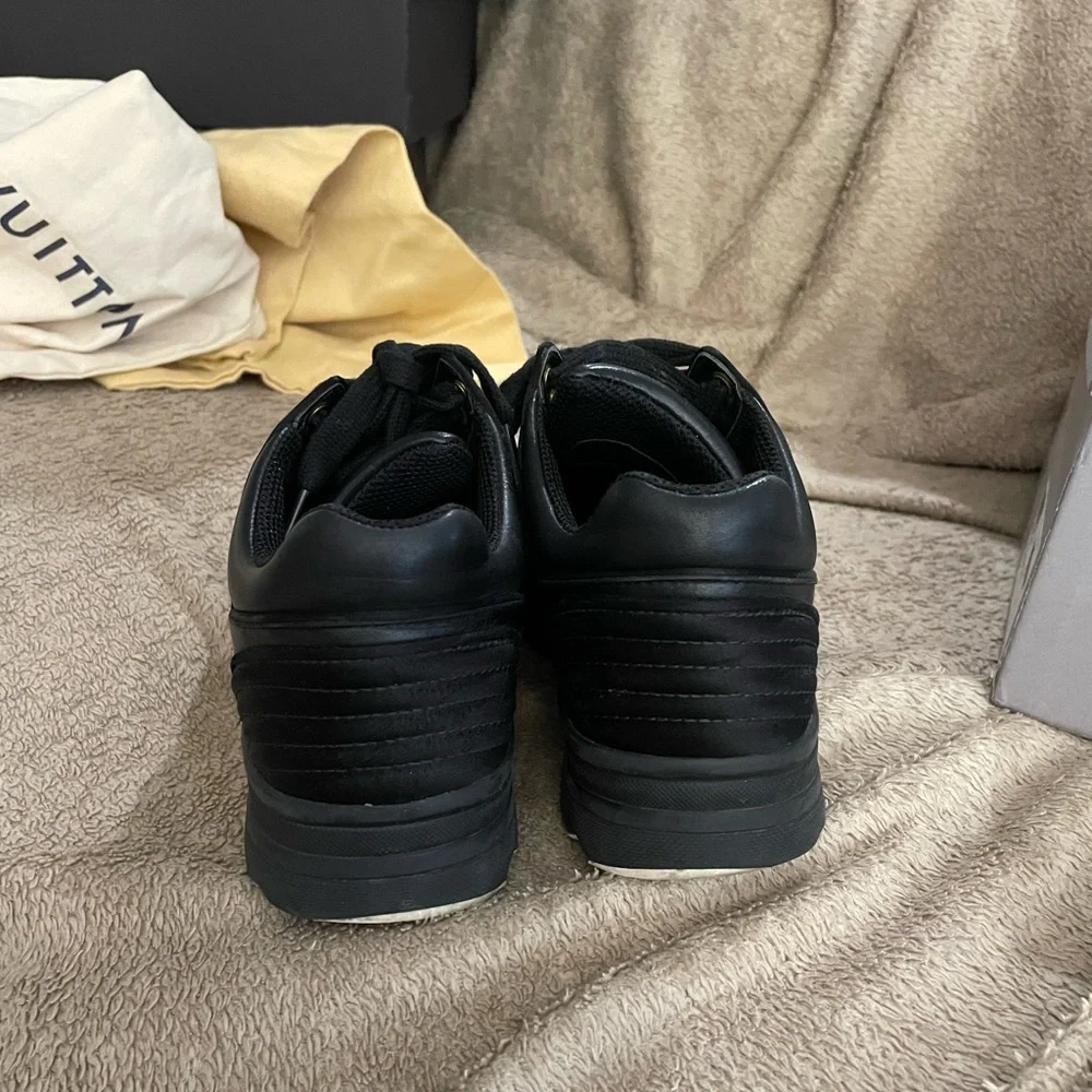 CHANEL Black Leather Low-Top Sneakers with White Accent